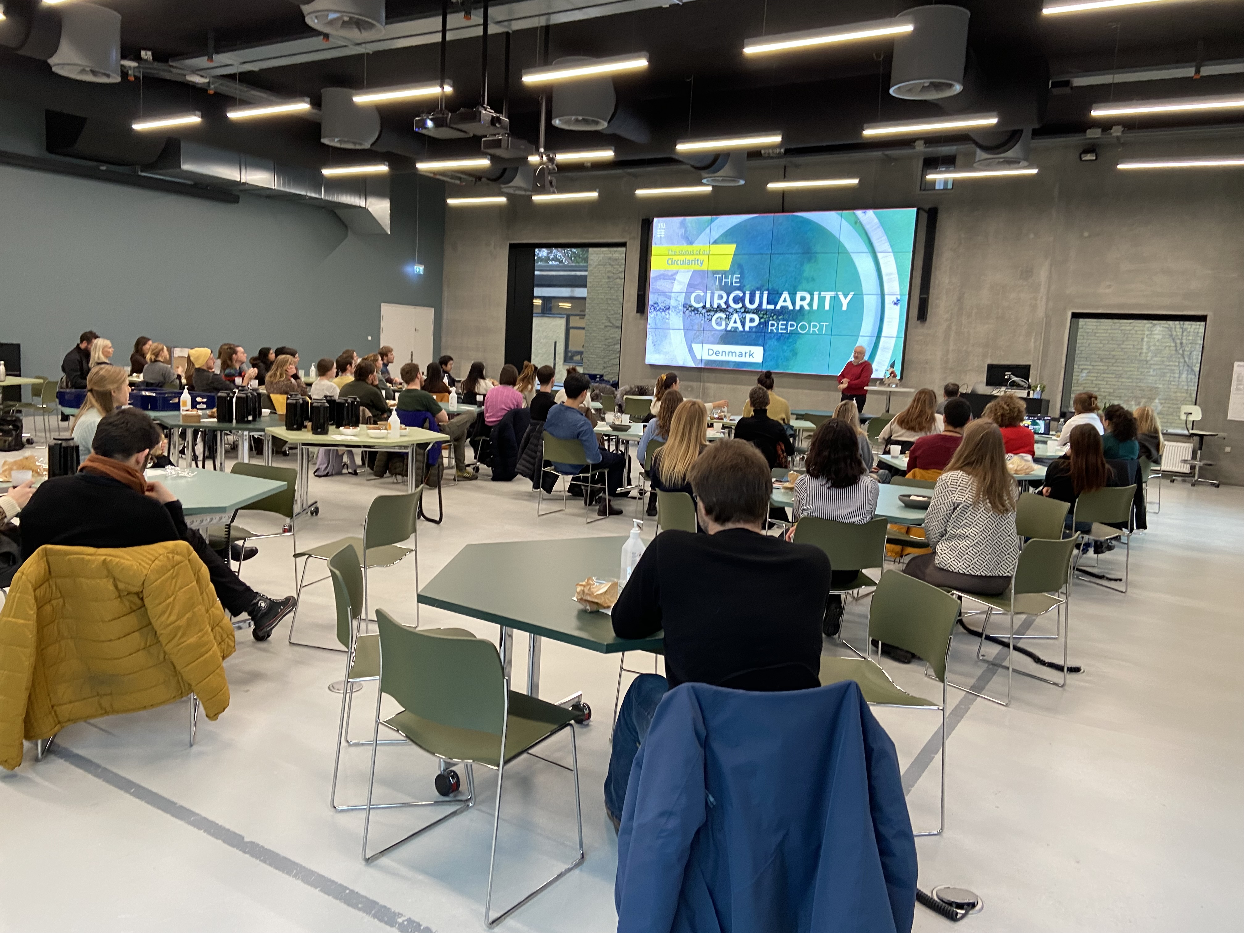 Photo of an audience watching a presentation
